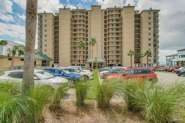 a view of swimming pool with outdoor seating and plants