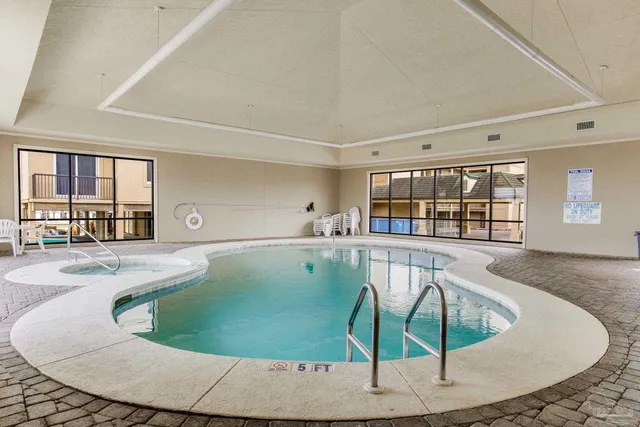 a view of a living room and kitchen