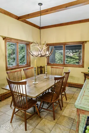 a bathroom with a granite countertop sink mirror and a shower