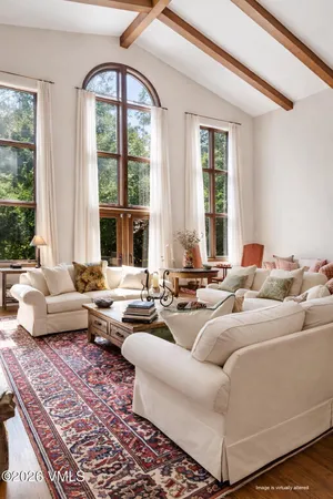 a spacious bathroom with a toilet sink and mirror
