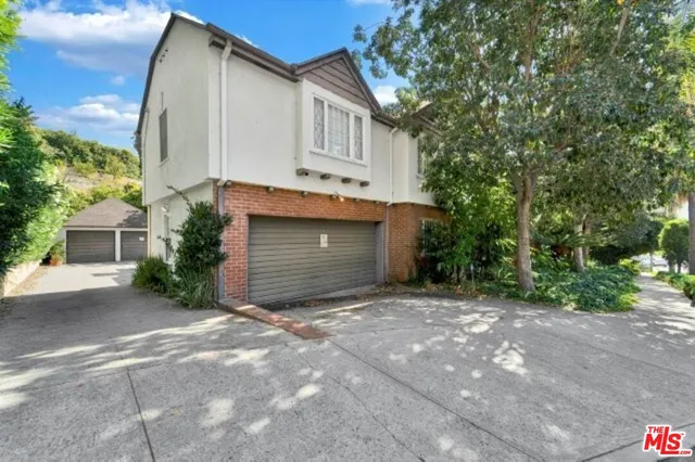 a front view of a house with a garage