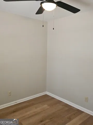 an empty room with a fan