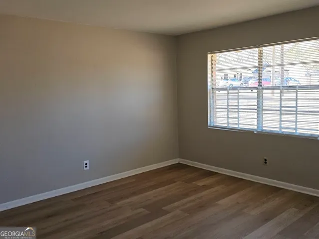 wooden floor and window in an empty room