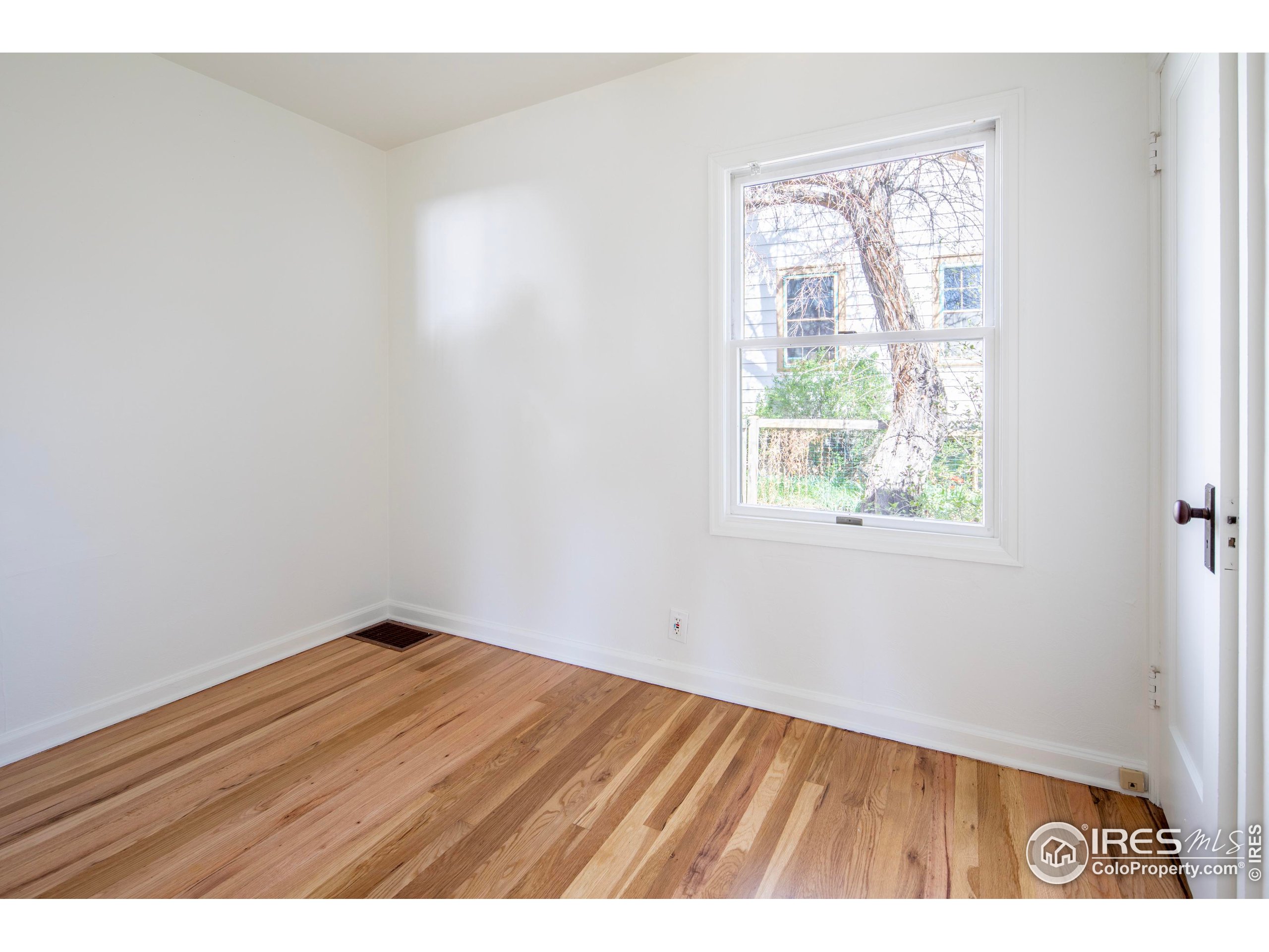 2447 20th Street Boulder, CO 80304 - Photo 15 of 35 a view of an empty room and wooden floor