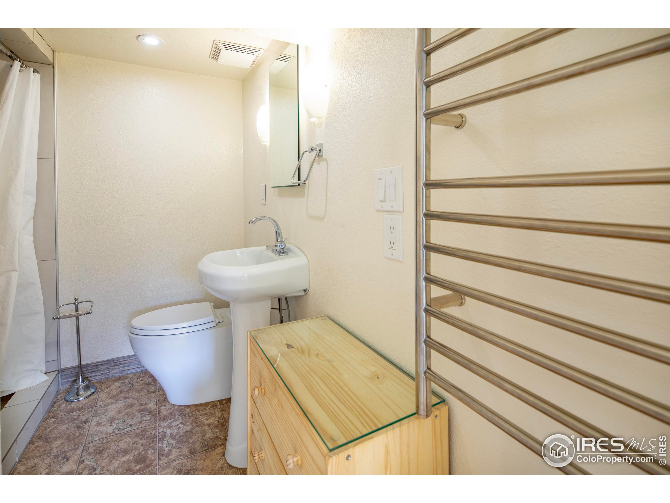 2447 20th Street Boulder, CO 80304 - Photo 17 of 35 a bathroom with a sink toilet and shower