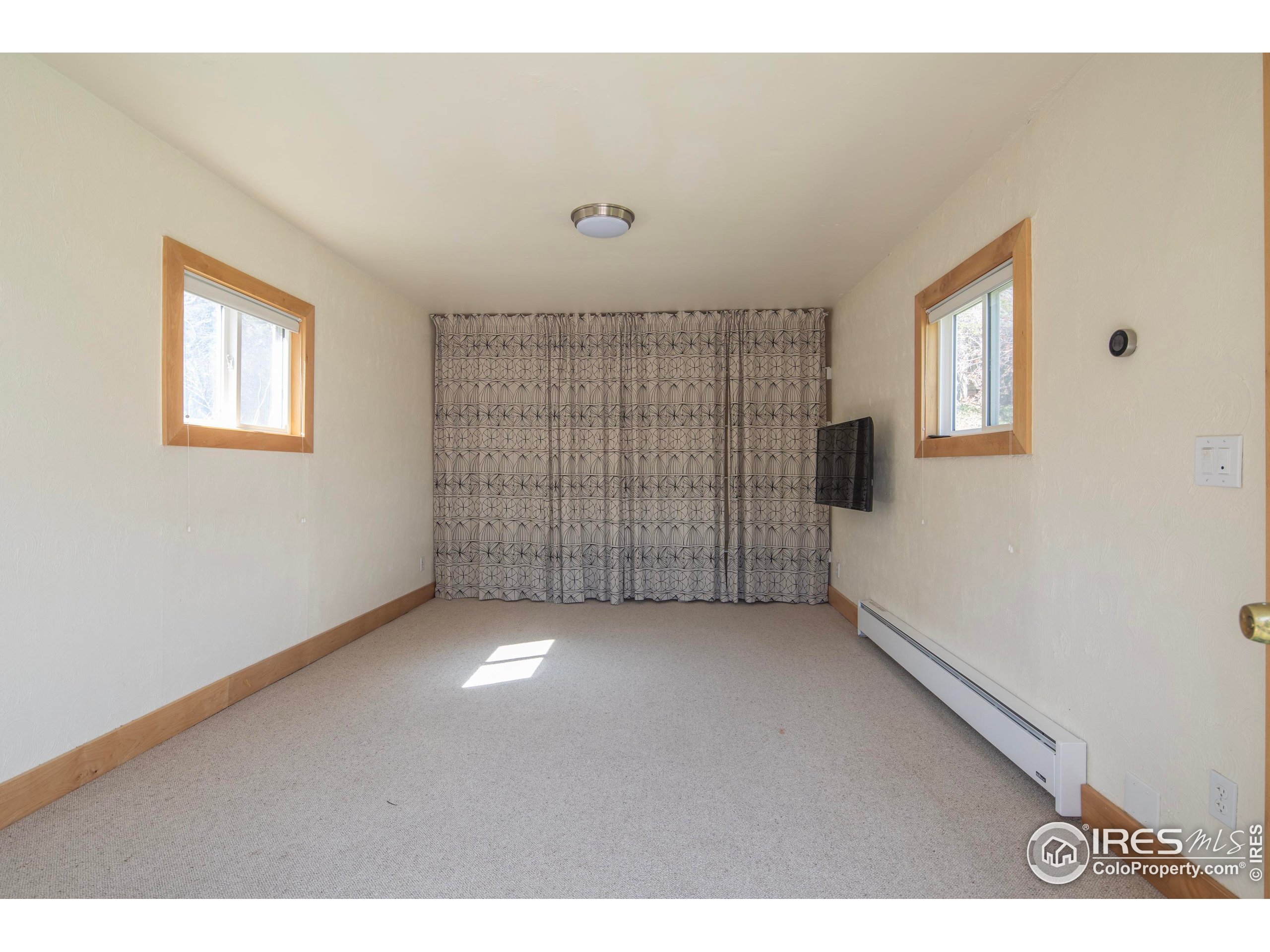 2447 20th Street Boulder, CO 80304 - Photo 22 of 35 a view of an empty room with a window
