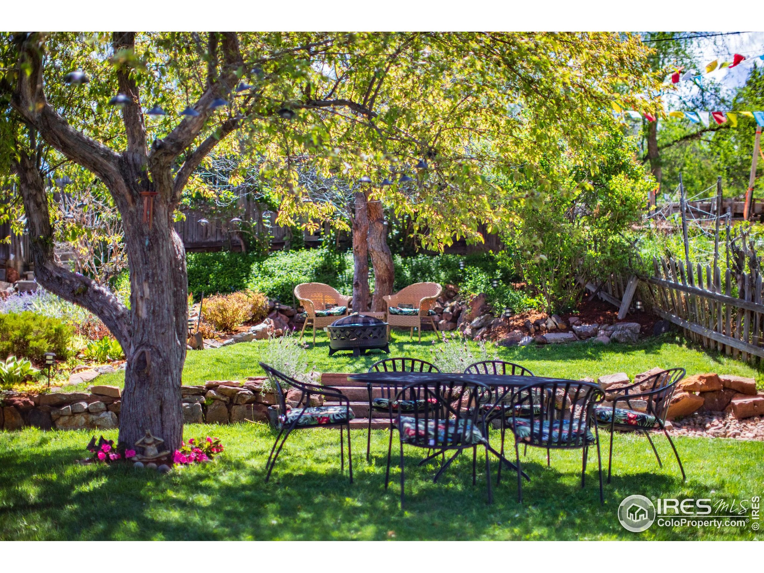 2447 20th Street Boulder, CO 80304 - Photo 23 of 35 a view of a chairs and table in a garden