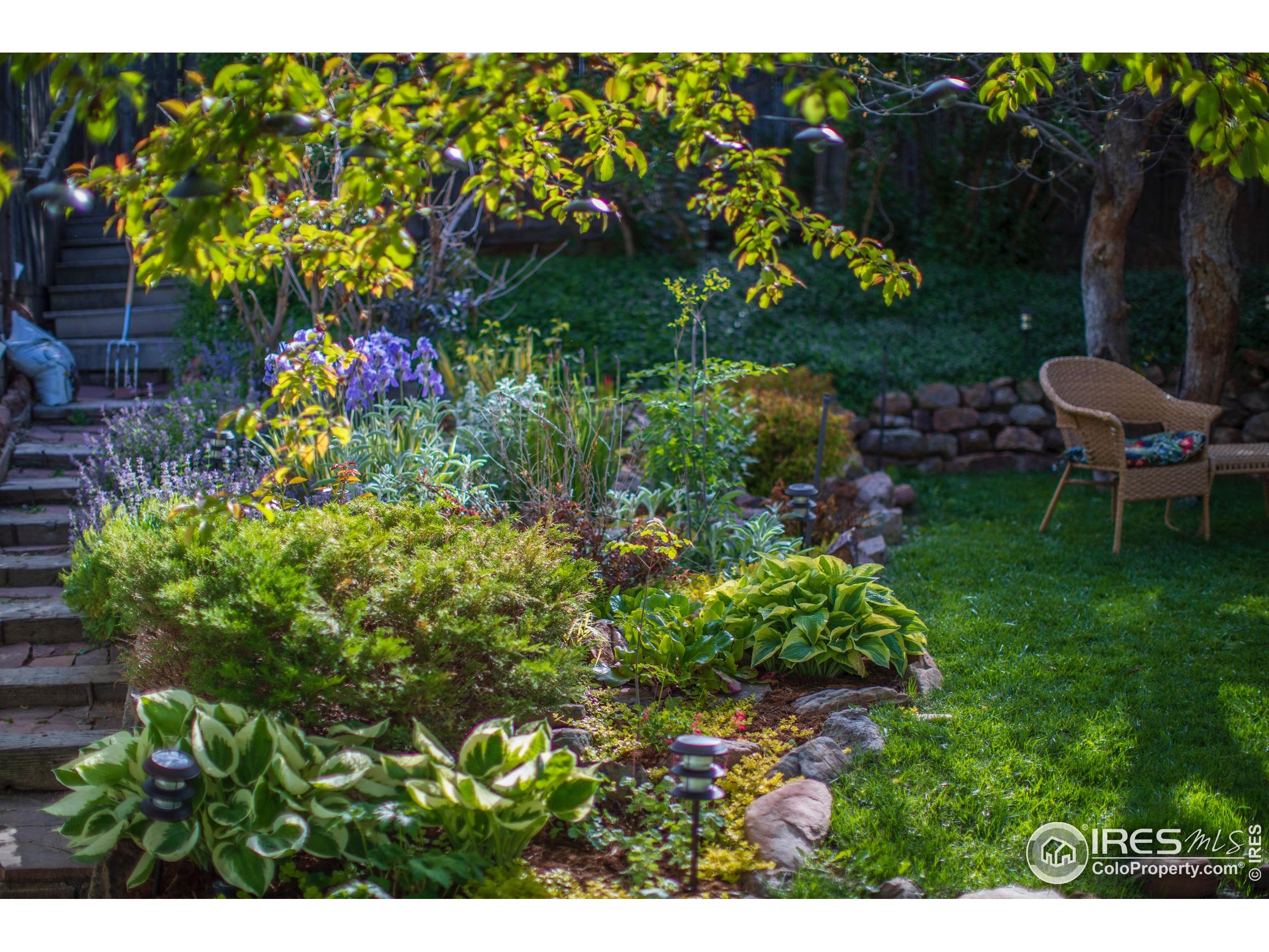 2447 20th Street Boulder, CO 80304 - Photo 25 of 35 a view of a back yard of the house and green space