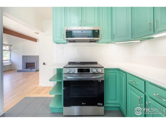 a kitchen with a cabinets and a stove top oven