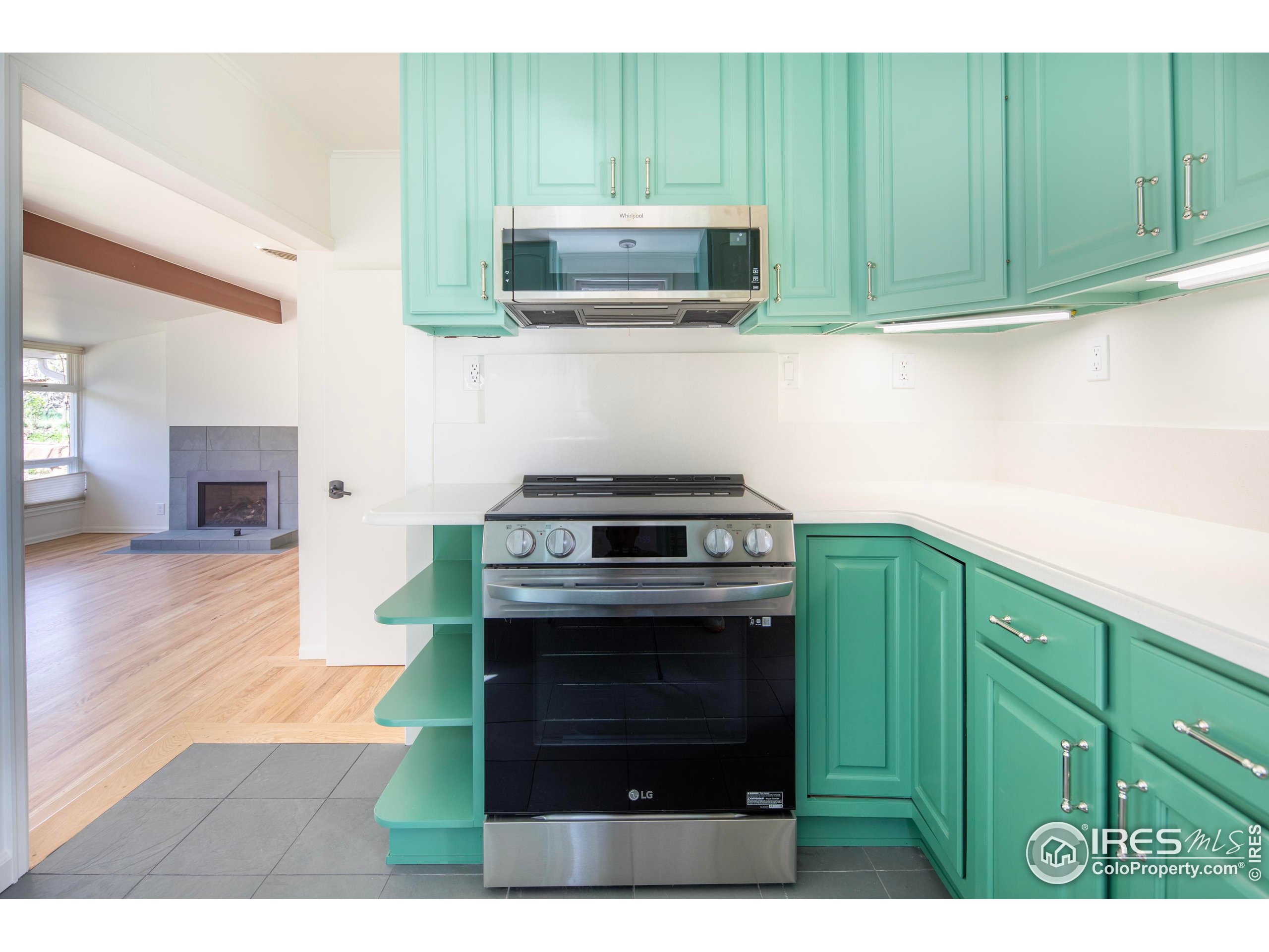 2447 20th Street Boulder, CO 80304 - Photo 5 of 35 a kitchen with a cabinets and a stove top oven