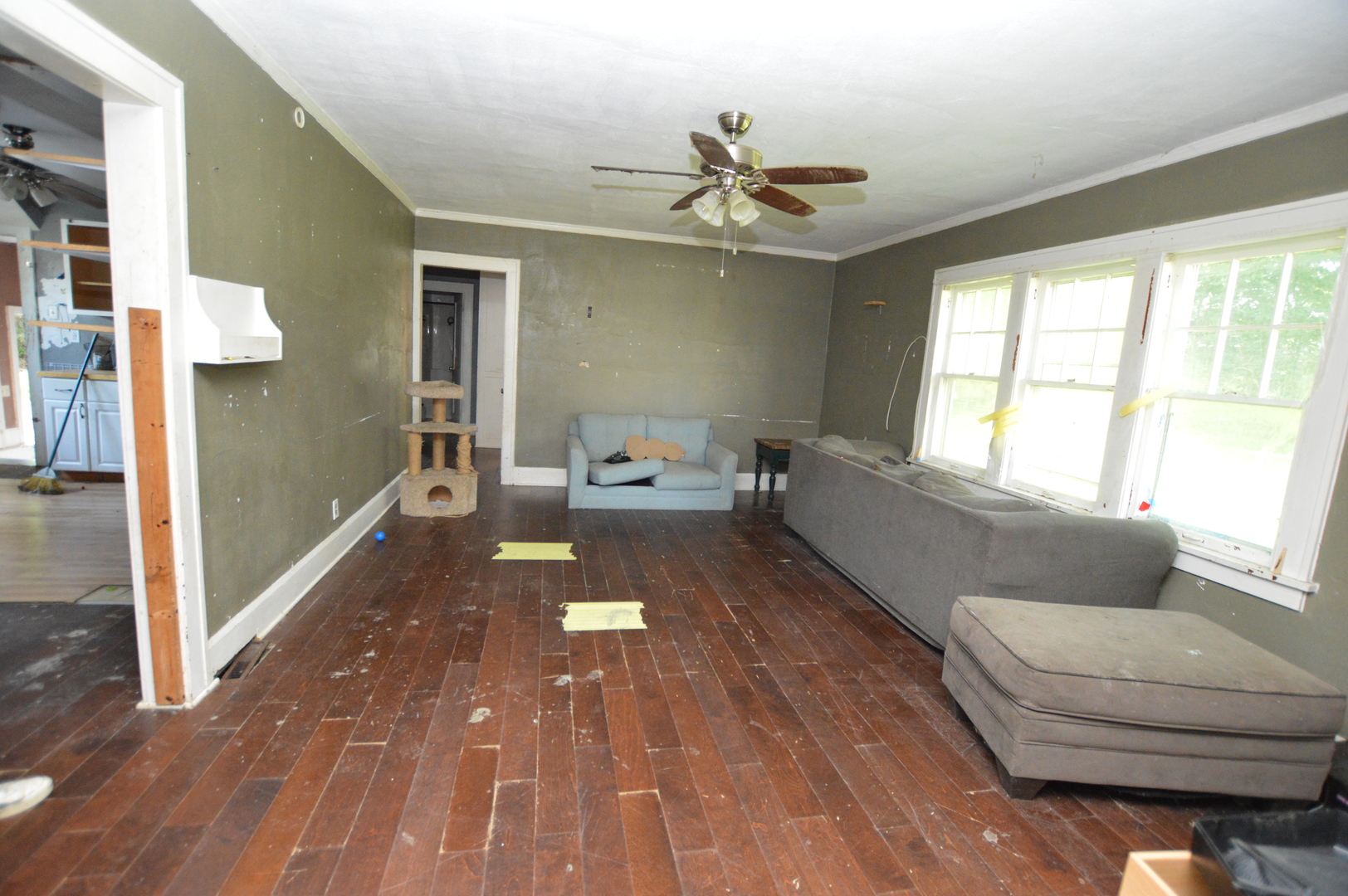 5807 Forest Hills Road Rockford, IL 61114 - Photo 12 of 23 a living room with furniture and a chandelier