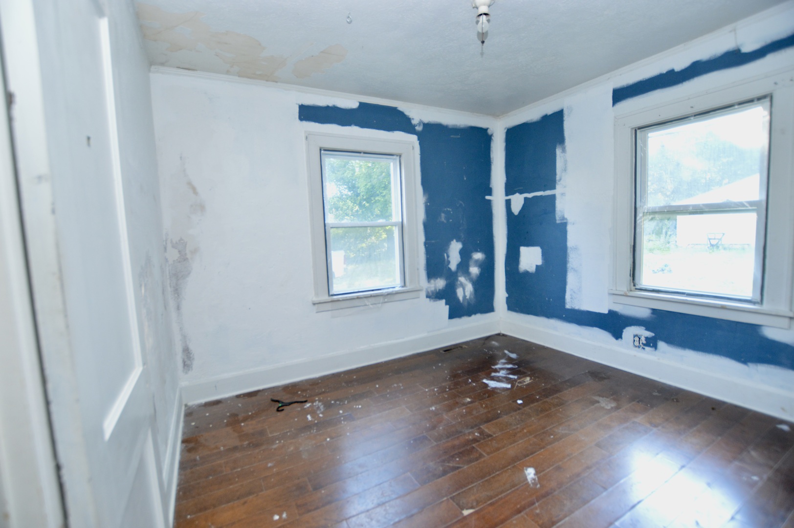 5807 Forest Hills Road Rockford, IL 61114 - Photo 18 of 23 an empty room with wooden floor and windows