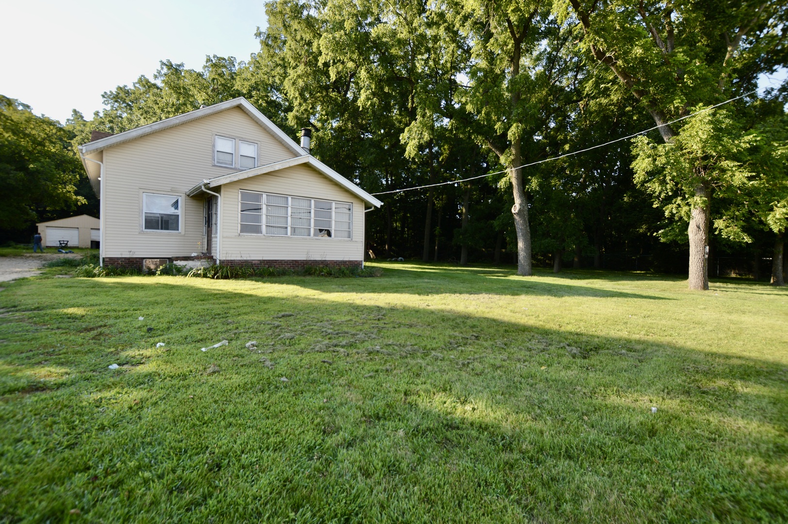 5807 Forest Hills Road Rockford, IL 61114 - Photo 2 of 23 a front view of house with yard and green space