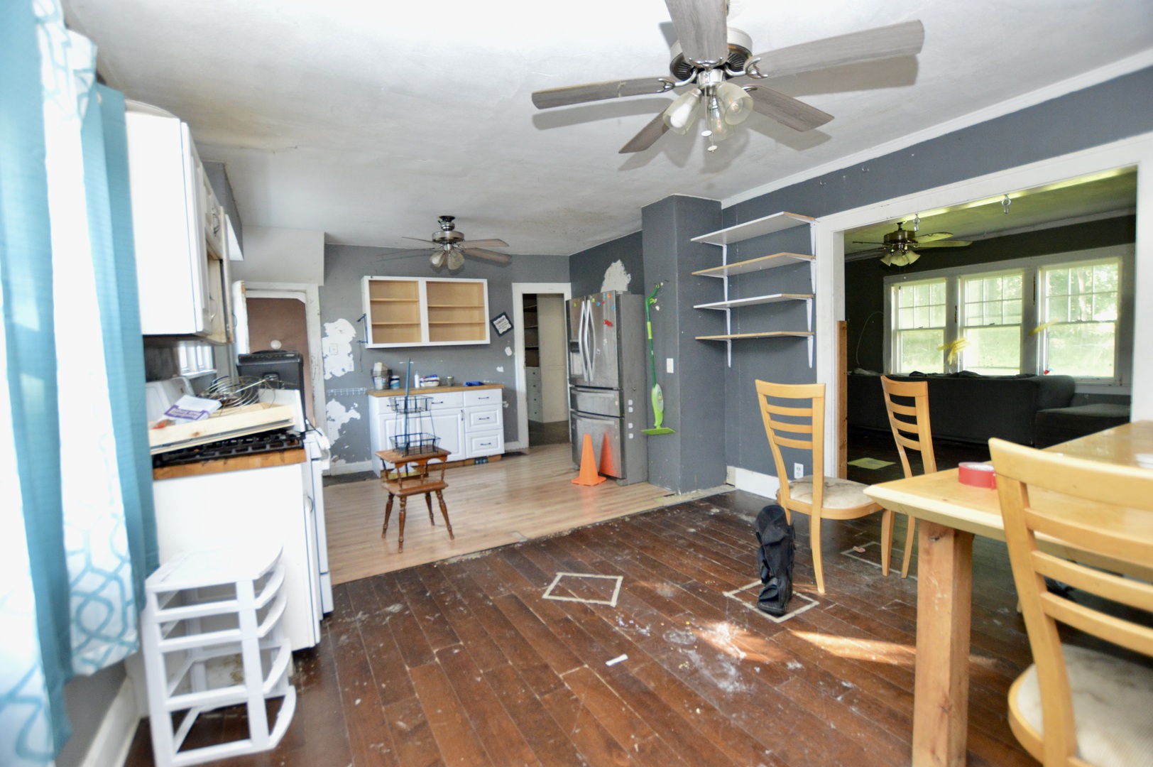 5807 Forest Hills Road Rockford, IL 61114 - Photo 10 of 23 a living room with furniture a dining table and chairs with kitchen view