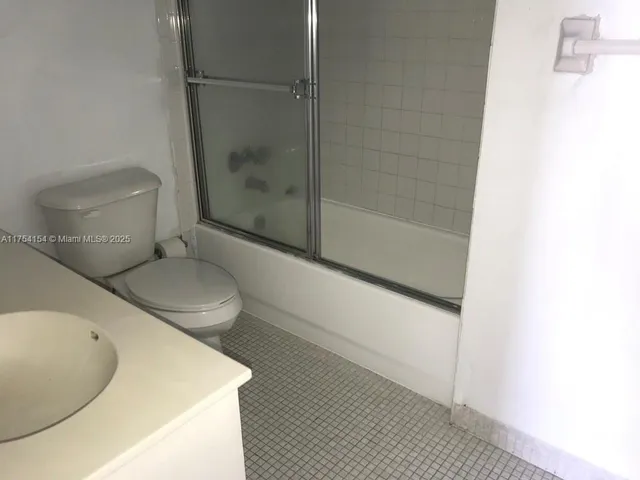 a bathroom with a sink and toilet