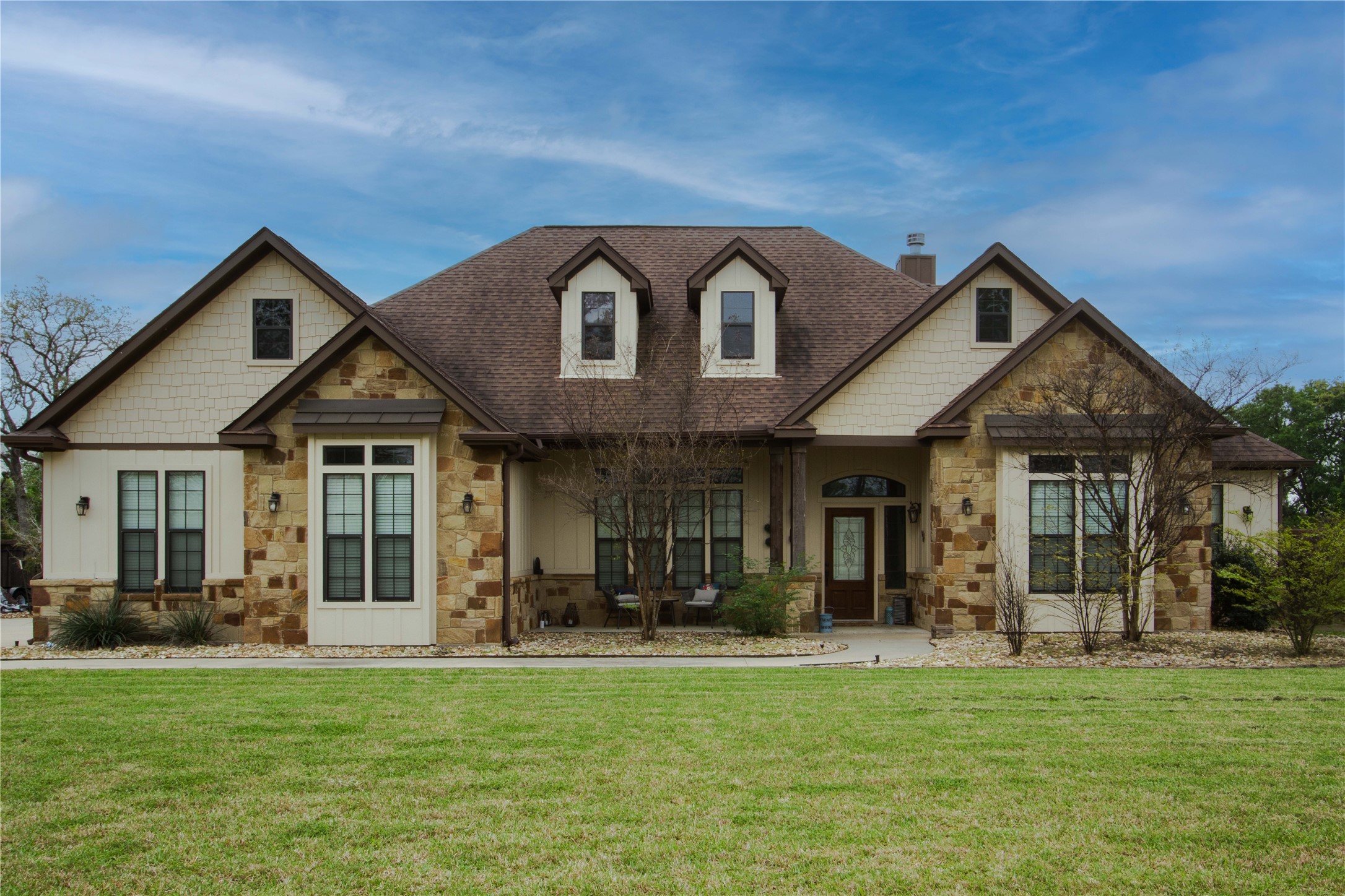 a front view of a house with a yard