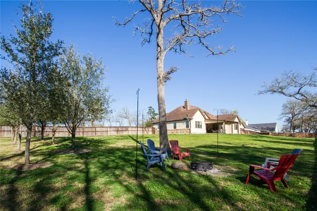 a view of a park with large trees