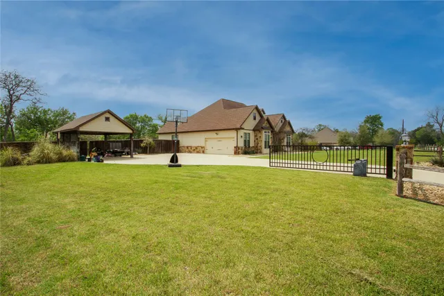 a swimming pool with outdoor seating and yard