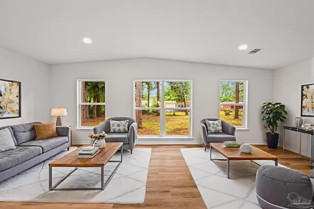 a living room with furniture and a table