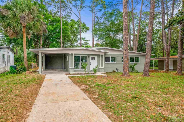 front view of a house with a yard