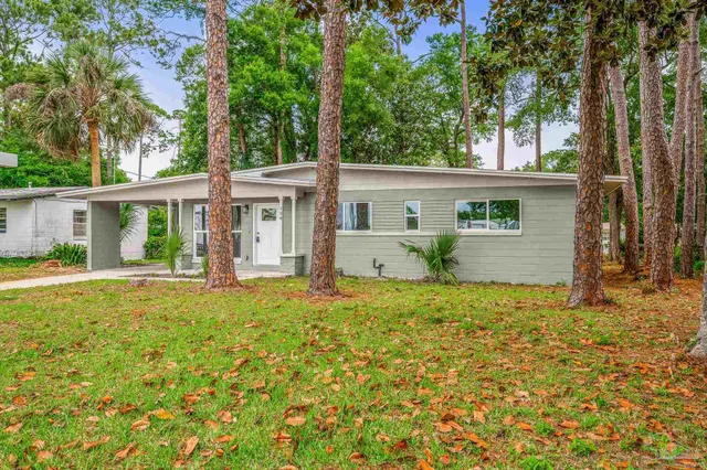 front view of a house with a yard