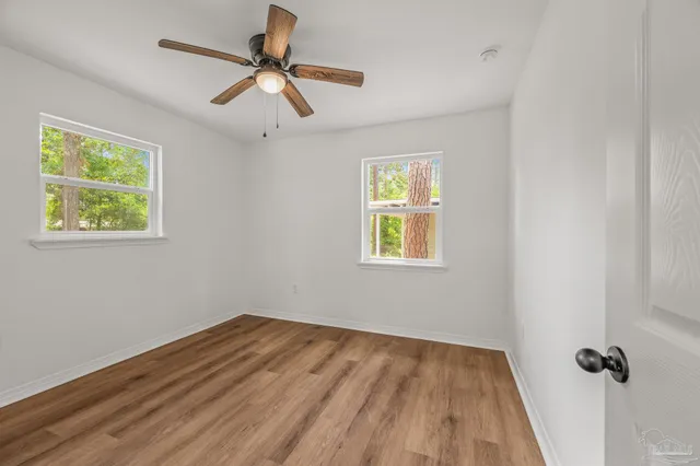 a view of room with window and ceiling fan