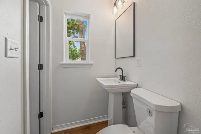 a view of a hallway with windows