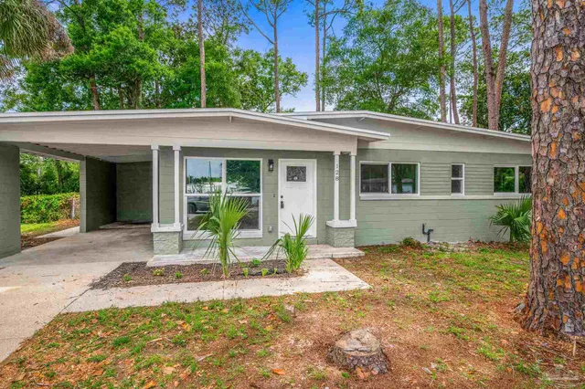 a house view with a sitting space and garden space