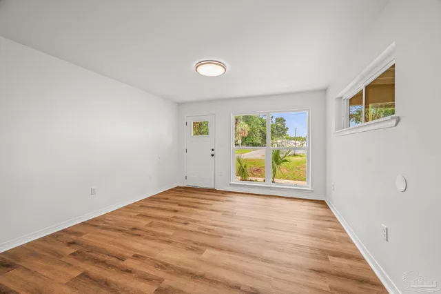 a view of an empty room with a window