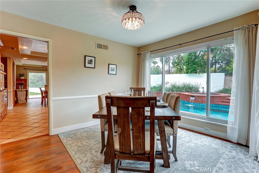 19238 Castlebay Lane Porter Ranch, CA 91326 - Photo 8 of 38 a view of a dining room with furniture window and wooden floor