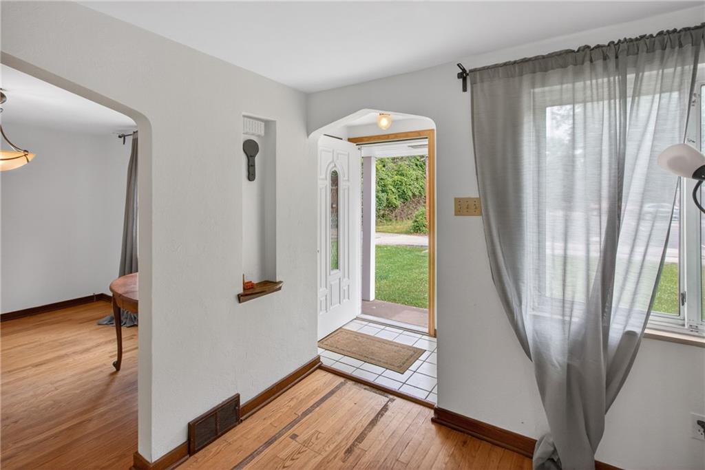 1420 Homestead Road Verona, PA 15147 - Photo 4 of 34 a view of entryway with wooden floor and door
