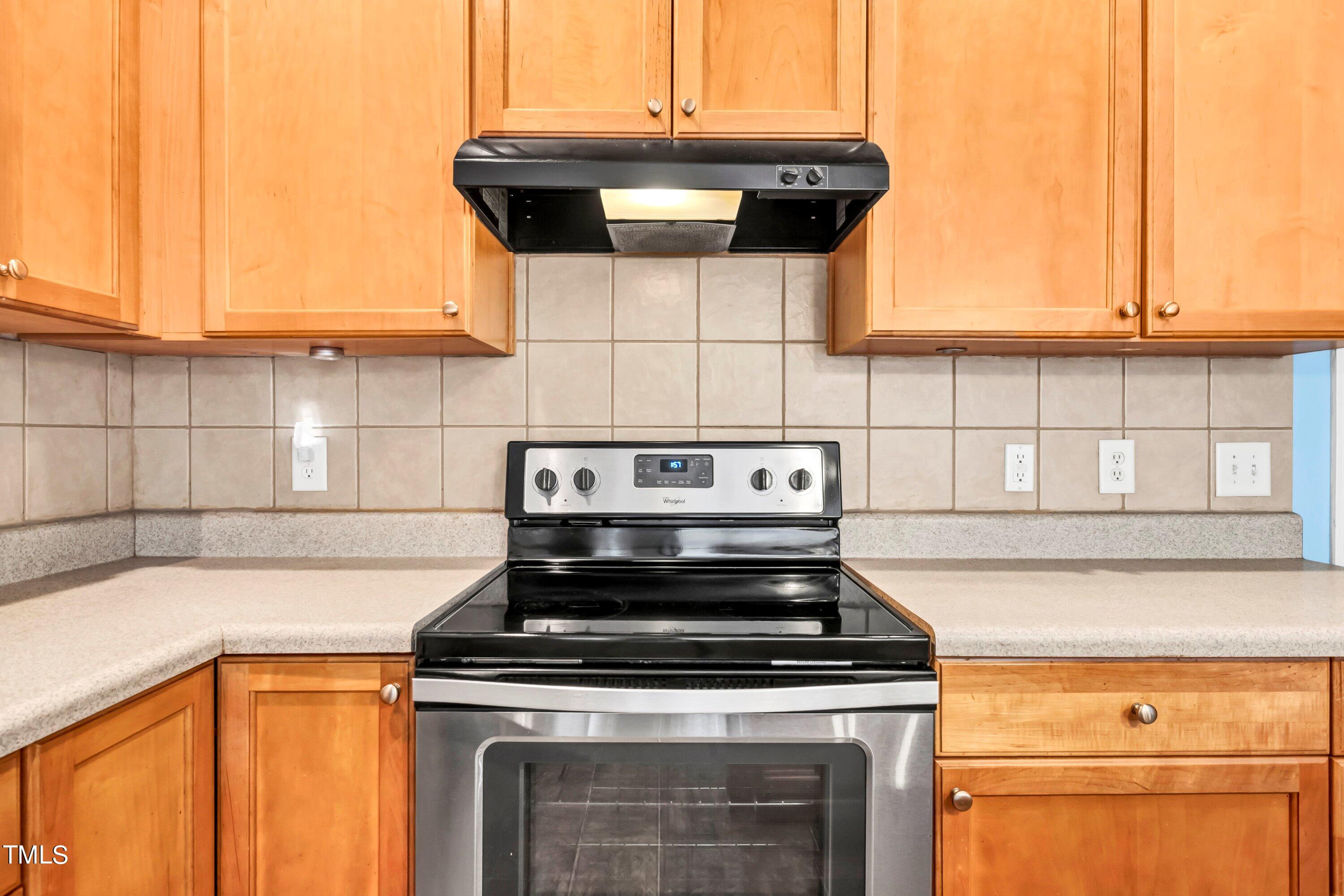 3932 Cane Garden Drive Raleigh, NC 27610 - Photo 11 of 34 a stove top oven sitting inside of a kitchen