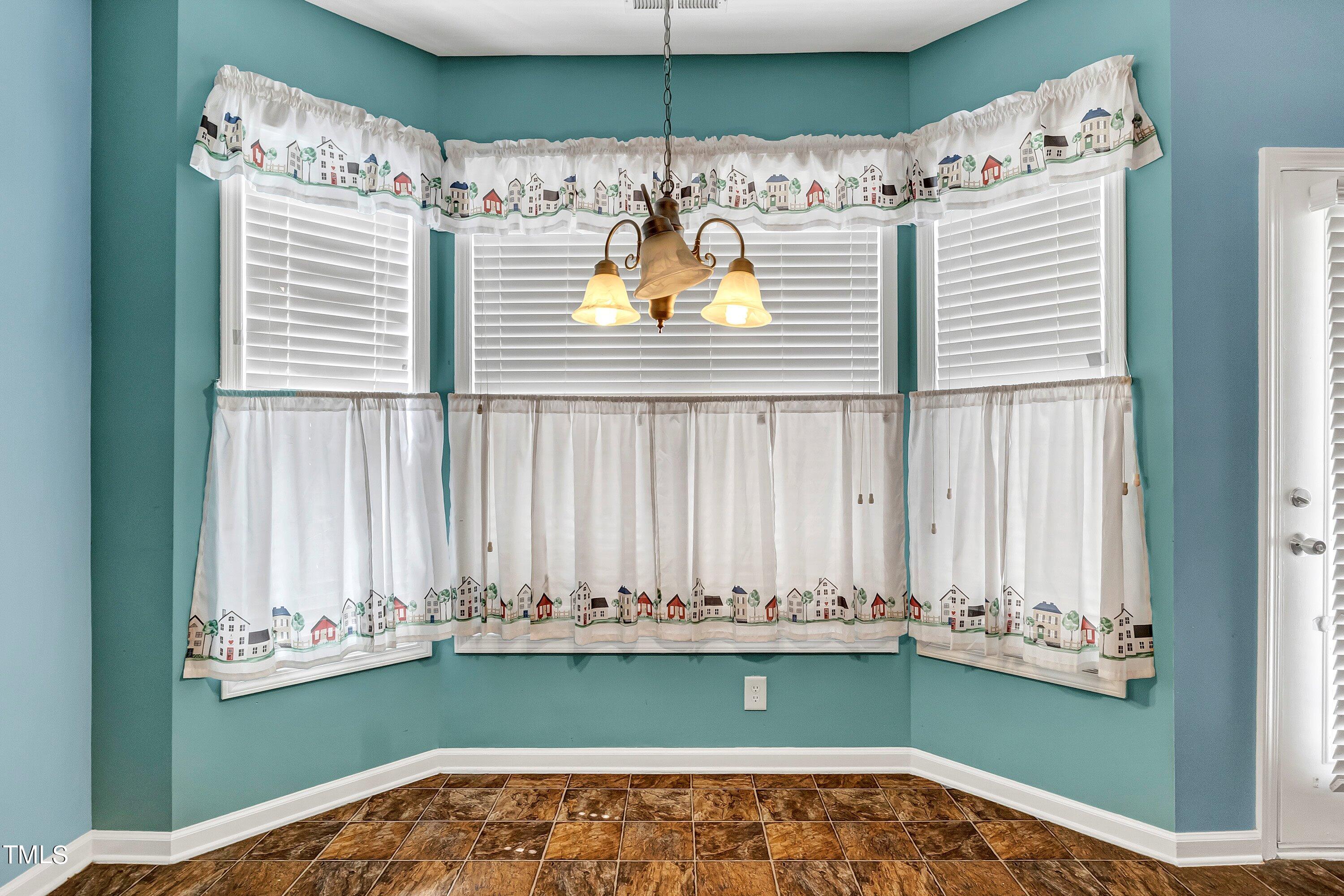 3932 Cane Garden Drive Raleigh, NC 27610 - Photo 13 of 34 a view of a room with a large window