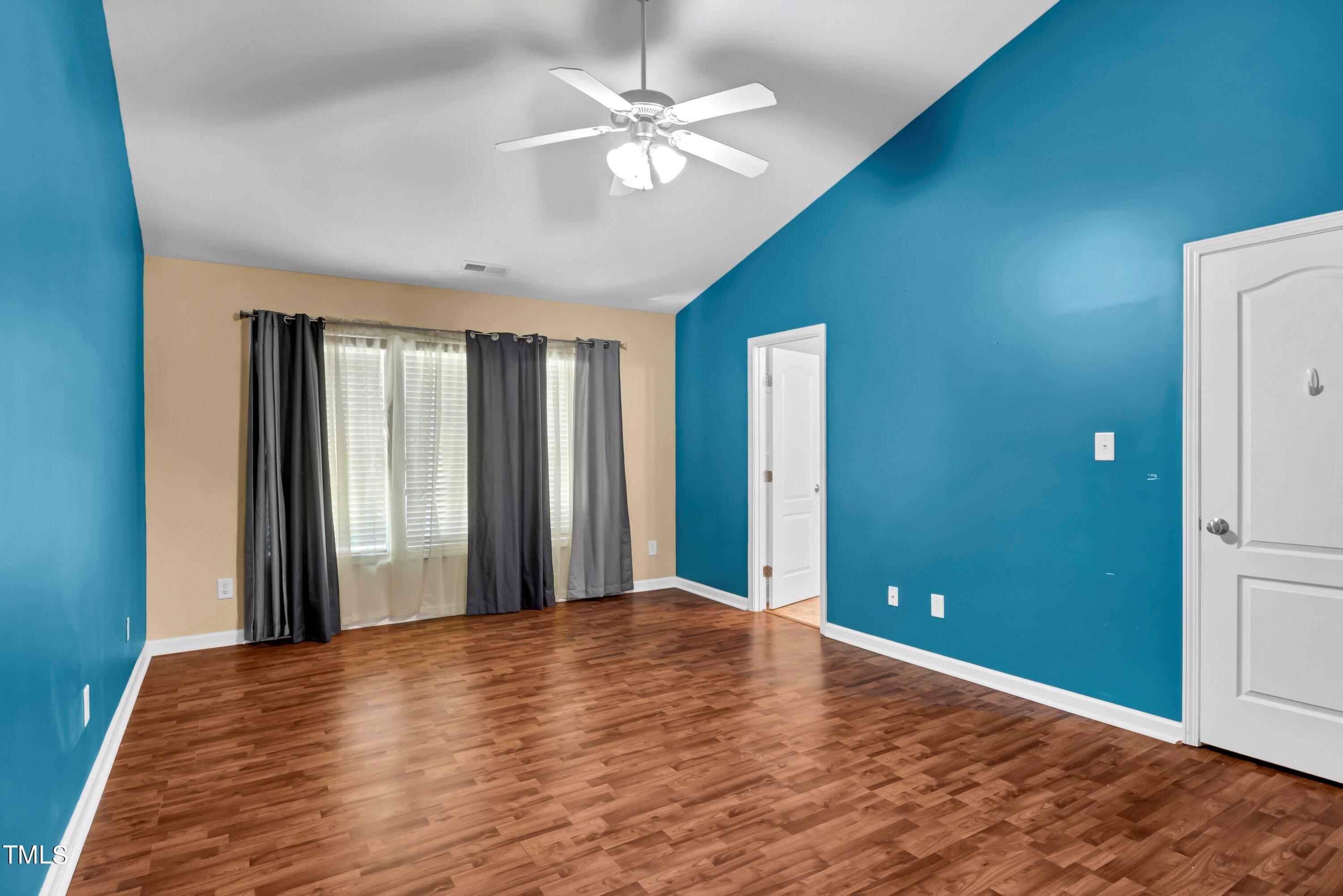 3932 Cane Garden Drive Raleigh, NC 27610 - Photo 19 of 34 wooden floor chandelier and windows in a room