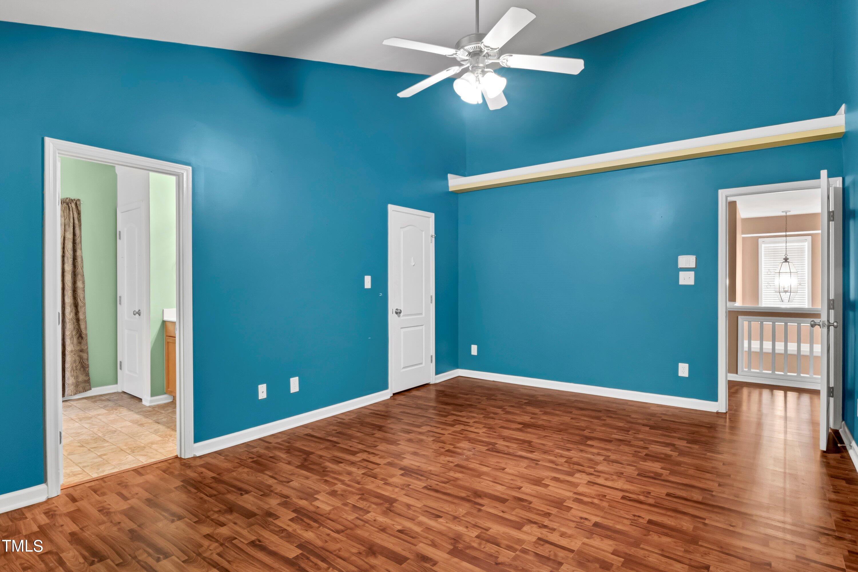 3932 Cane Garden Drive Raleigh, NC 27610 - Photo 20 of 34 a view of empty room with wooden floor