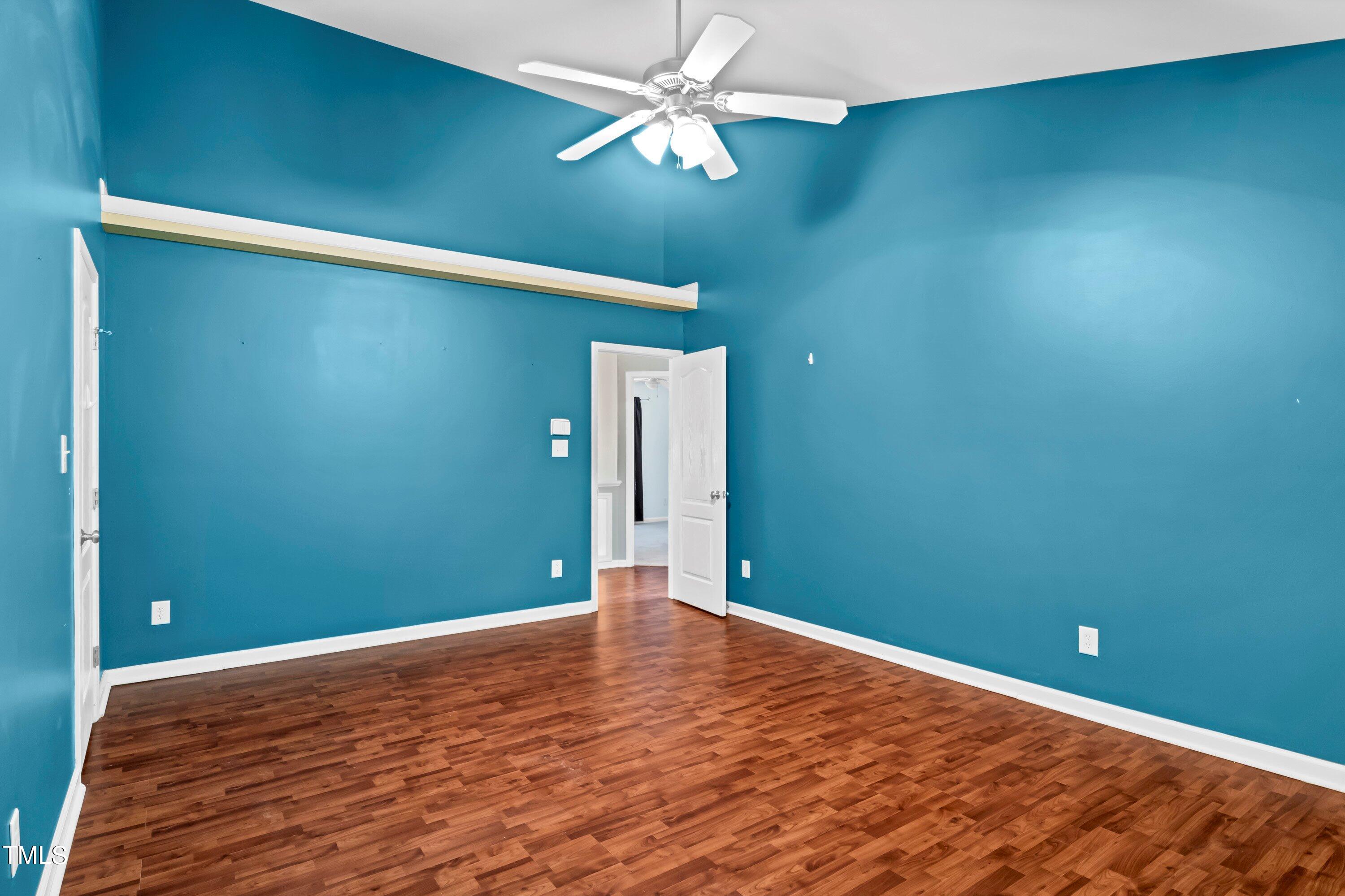 3932 Cane Garden Drive Raleigh, NC 27610 - Photo 21 of 34 a view of a big room with wooden floor