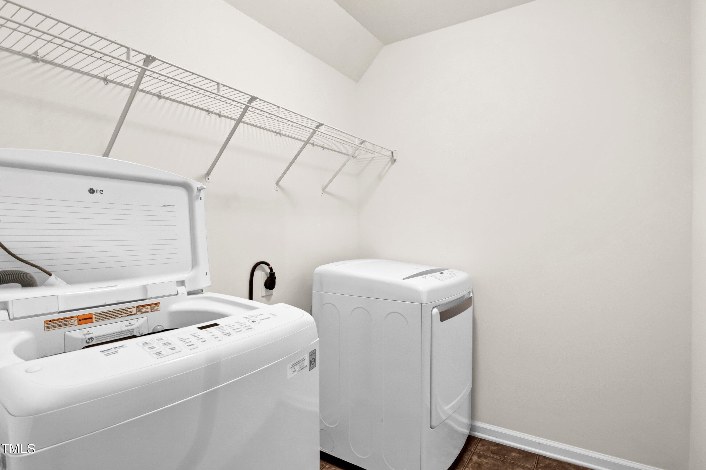 3932 Cane Garden Drive Raleigh, NC 27610 - Photo 28 of 34 a utility room with dryer and washer