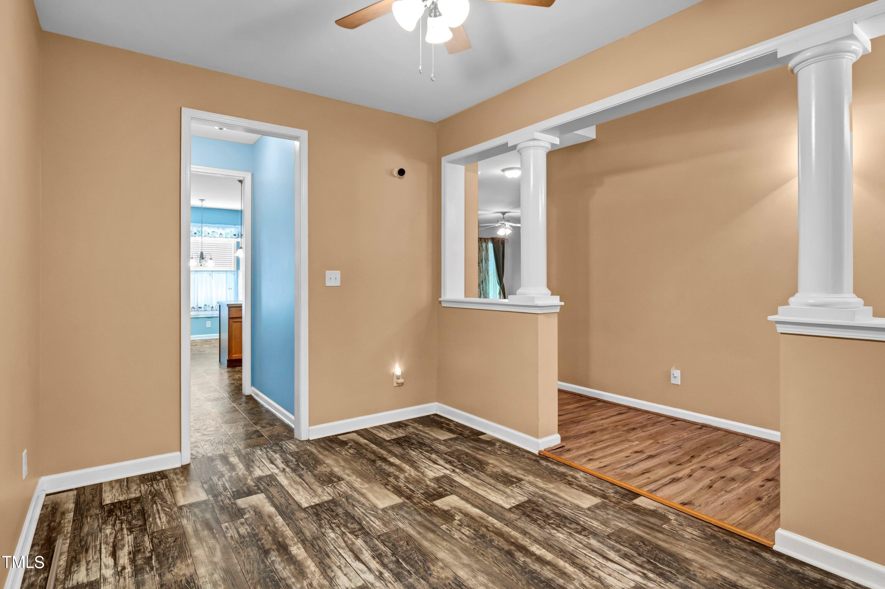 3932 Cane Garden Drive Raleigh, NC 27610 - Photo 6 of 34 a view of a room with wooden floor and a bathroom