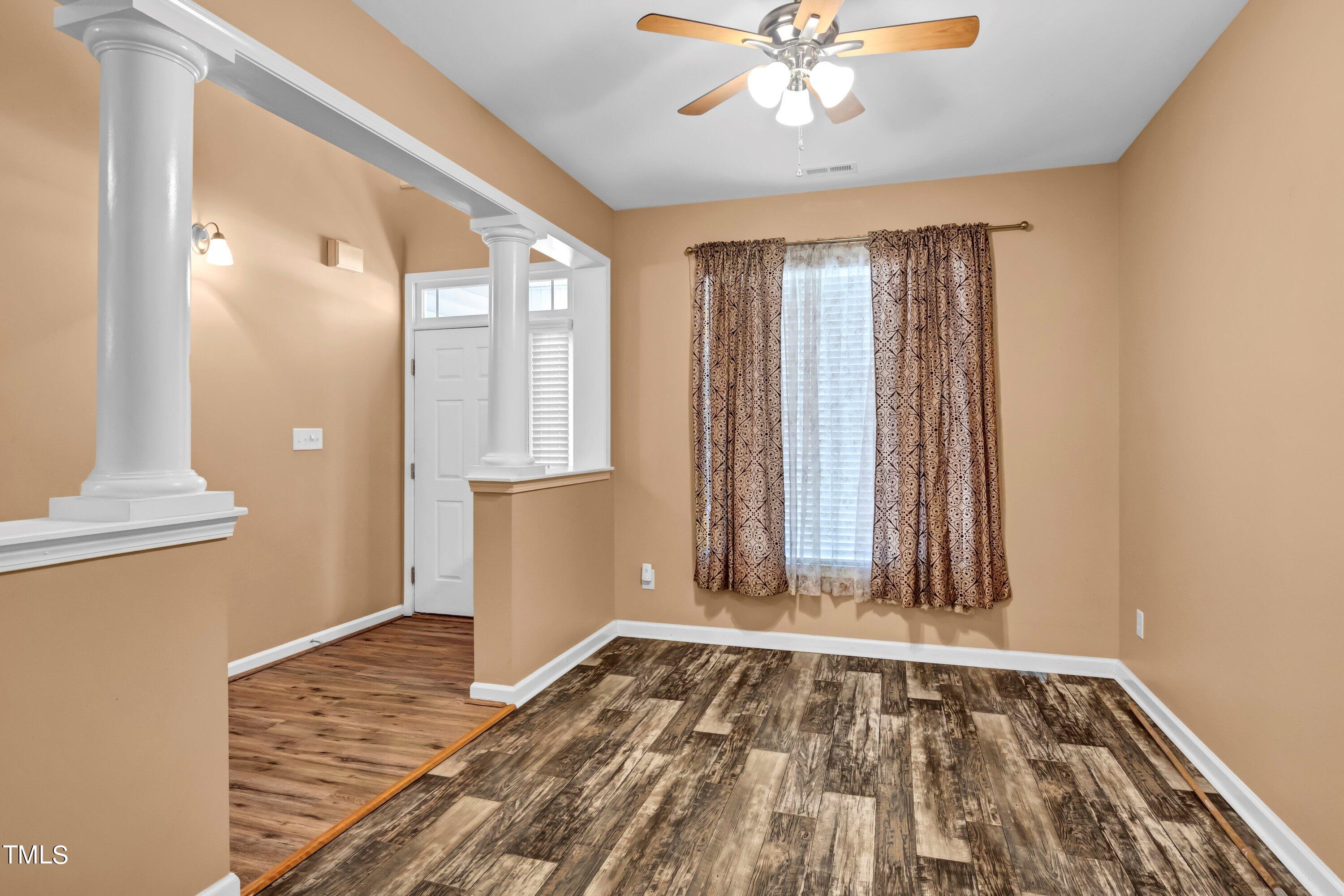 3932 Cane Garden Drive Raleigh, NC 27610 - Photo 7 of 34 a view of an entryway with wooden floor and cabinet