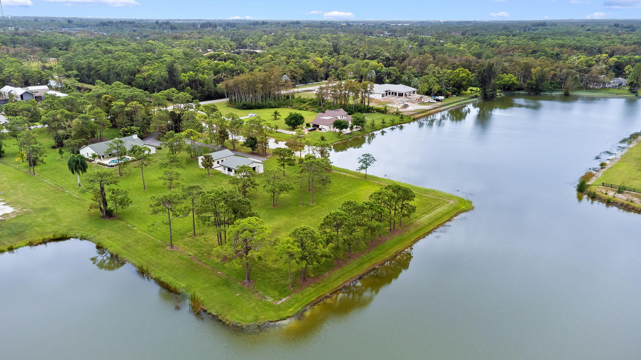 5635 Reynolds Road Lake Worth, FL 33449 - Photo 1 of 40 a view of a lake with a mountain in the background