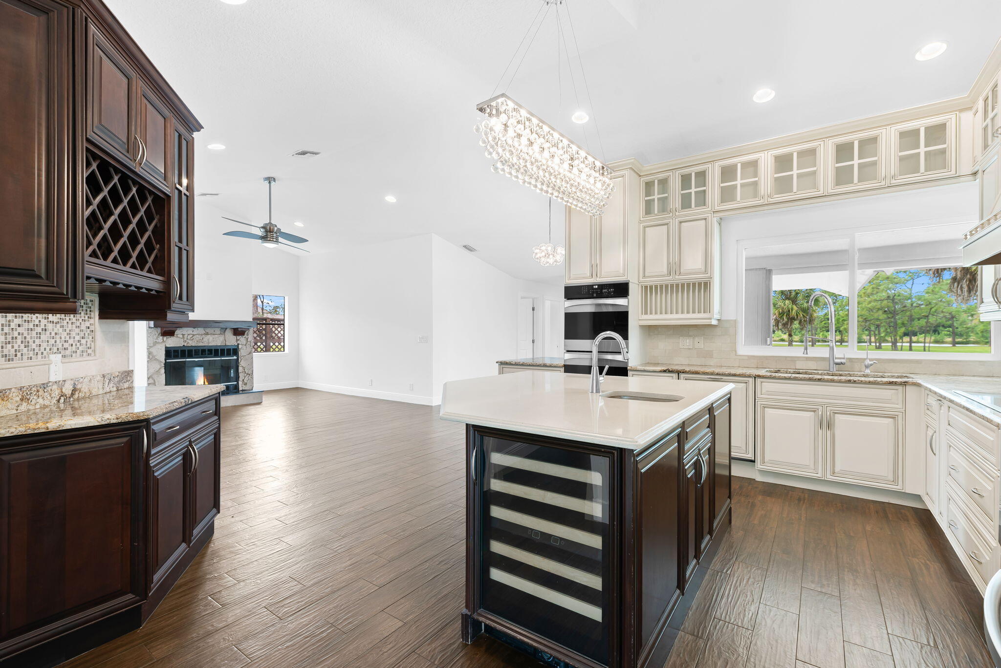 5635 Reynolds Road Lake Worth, FL 33449 - Photo 17 of 40 a kitchen with stainless steel appliances granite countertop a sink stove and refrigerator