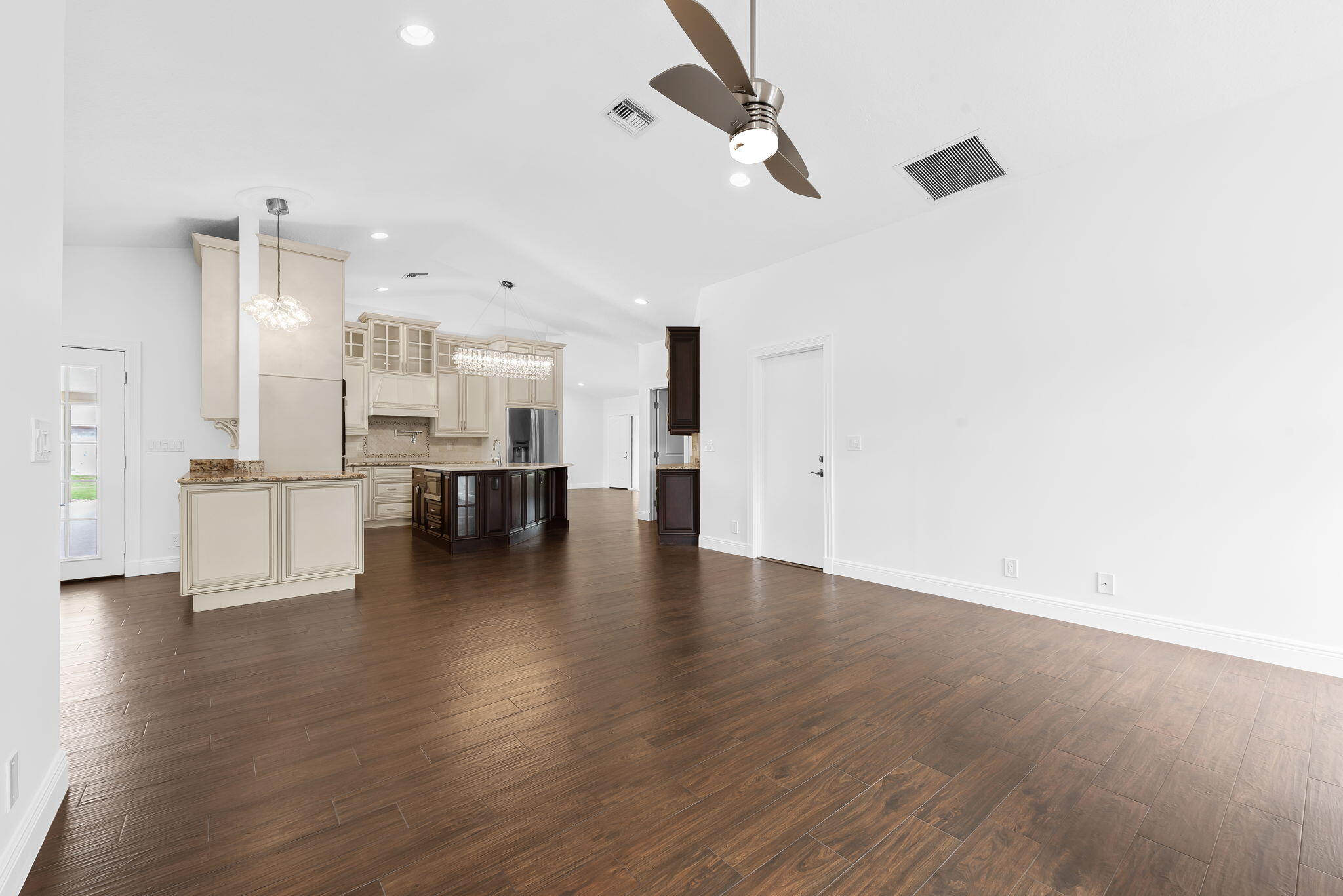 5635 Reynolds Road Lake Worth, FL 33449 - Photo 18 of 40 a view of kitchen and hall with wooden floor