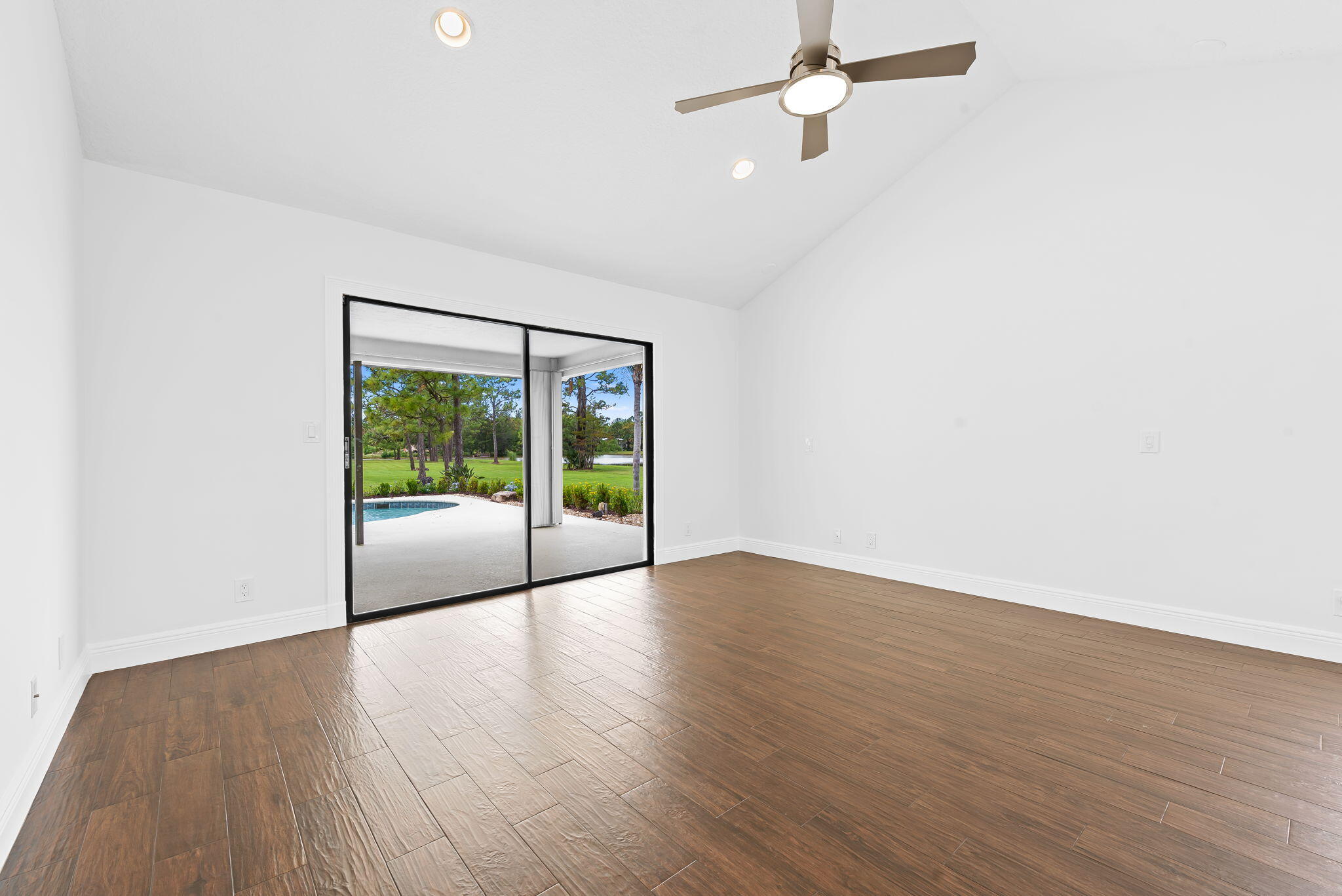 5635 Reynolds Road Lake Worth, FL 33449 - Photo 22 of 40 wooden floor in an empty room with a window