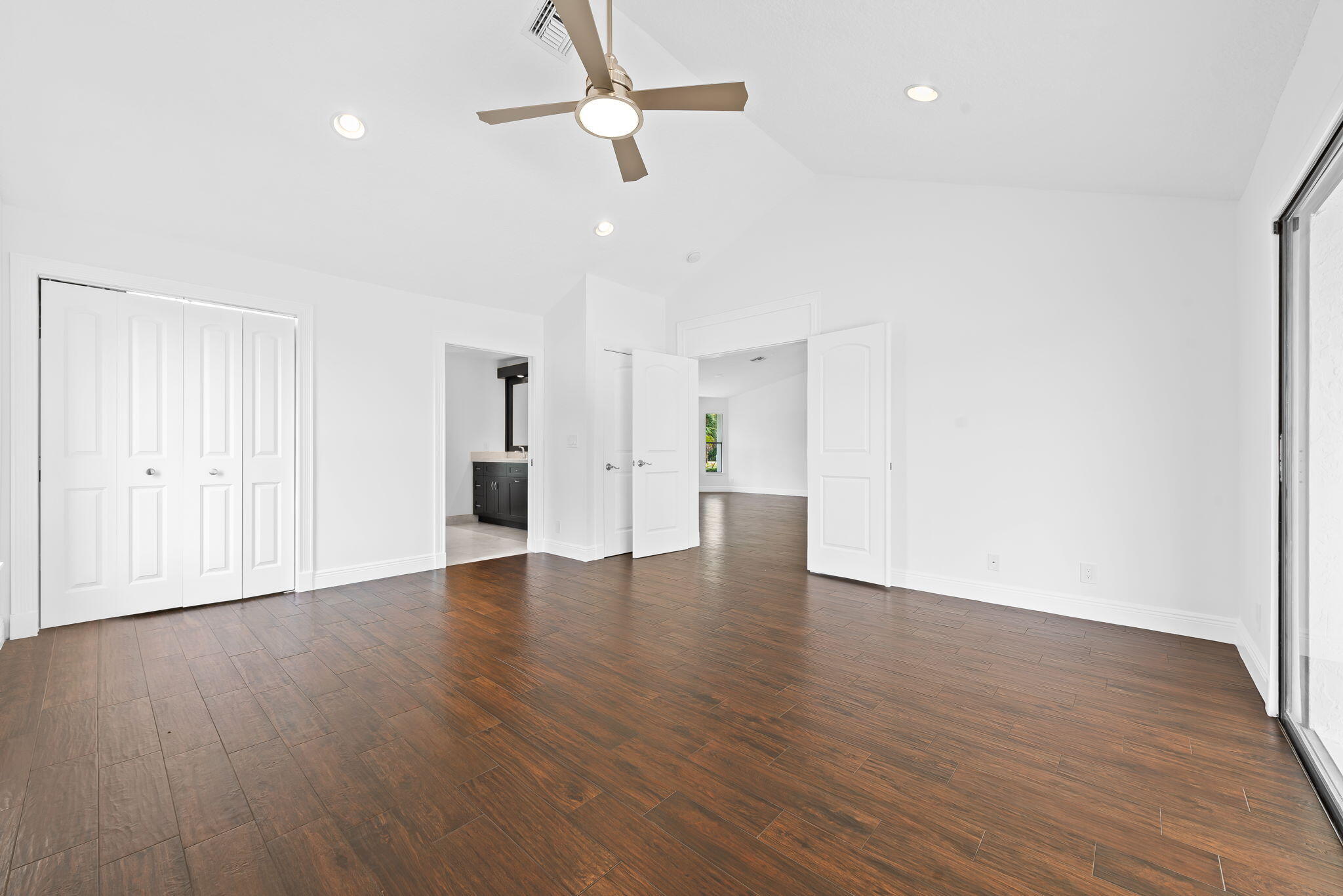 5635 Reynolds Road Lake Worth, FL 33449 - Photo 23 of 40 a view of an empty room with wooden floor