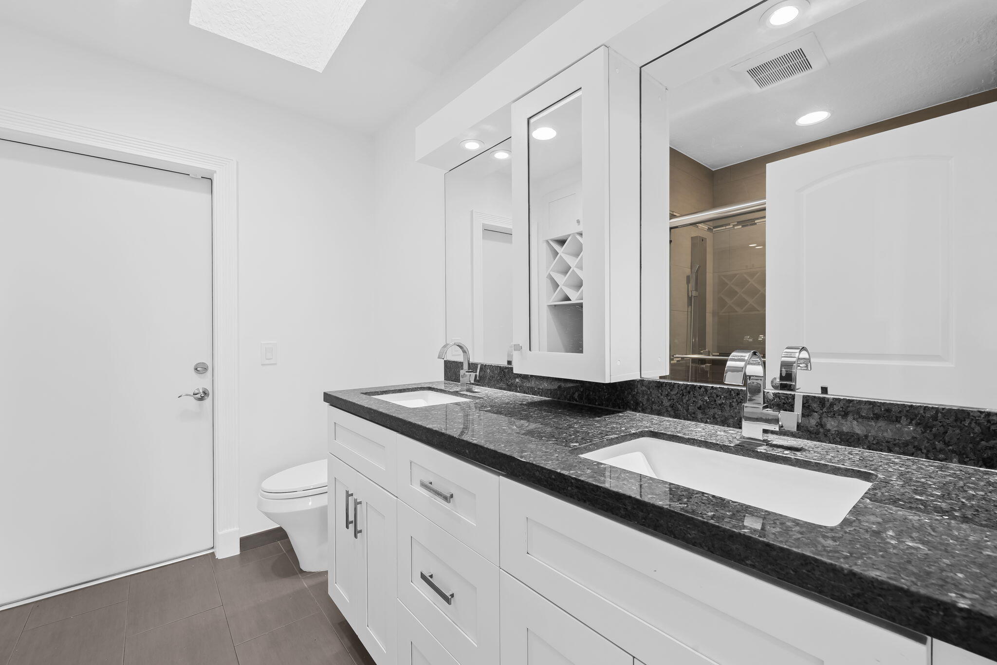 5635 Reynolds Road Lake Worth, FL 33449 - Photo 31 of 40 a bathroom with a granite countertop sink and a mirror