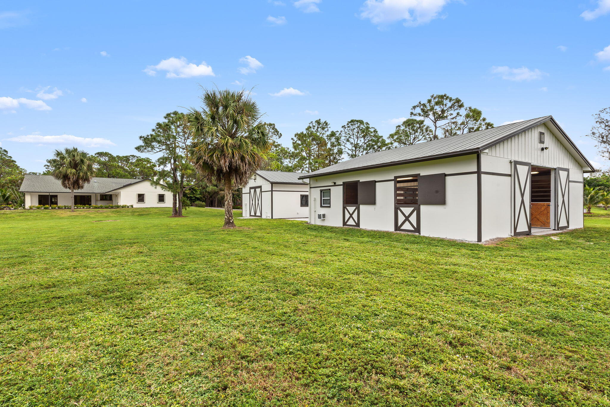 5635 Reynolds Road Lake Worth, FL 33449 - Photo 36 of 40 a view of a house with a backyard