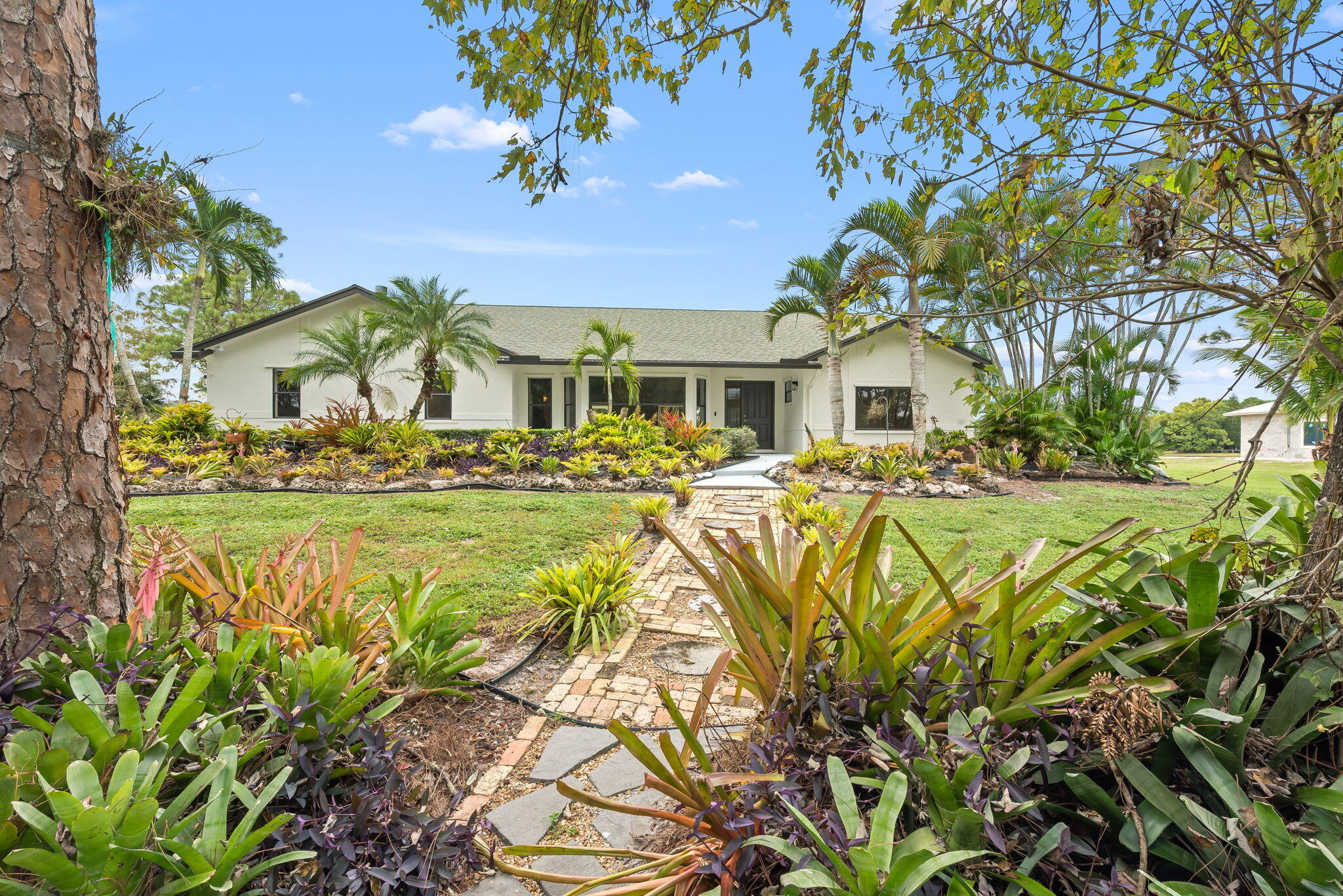 5635 Reynolds Road Lake Worth, FL 33449 - Photo 39 of 40 a view of a houses with a yard