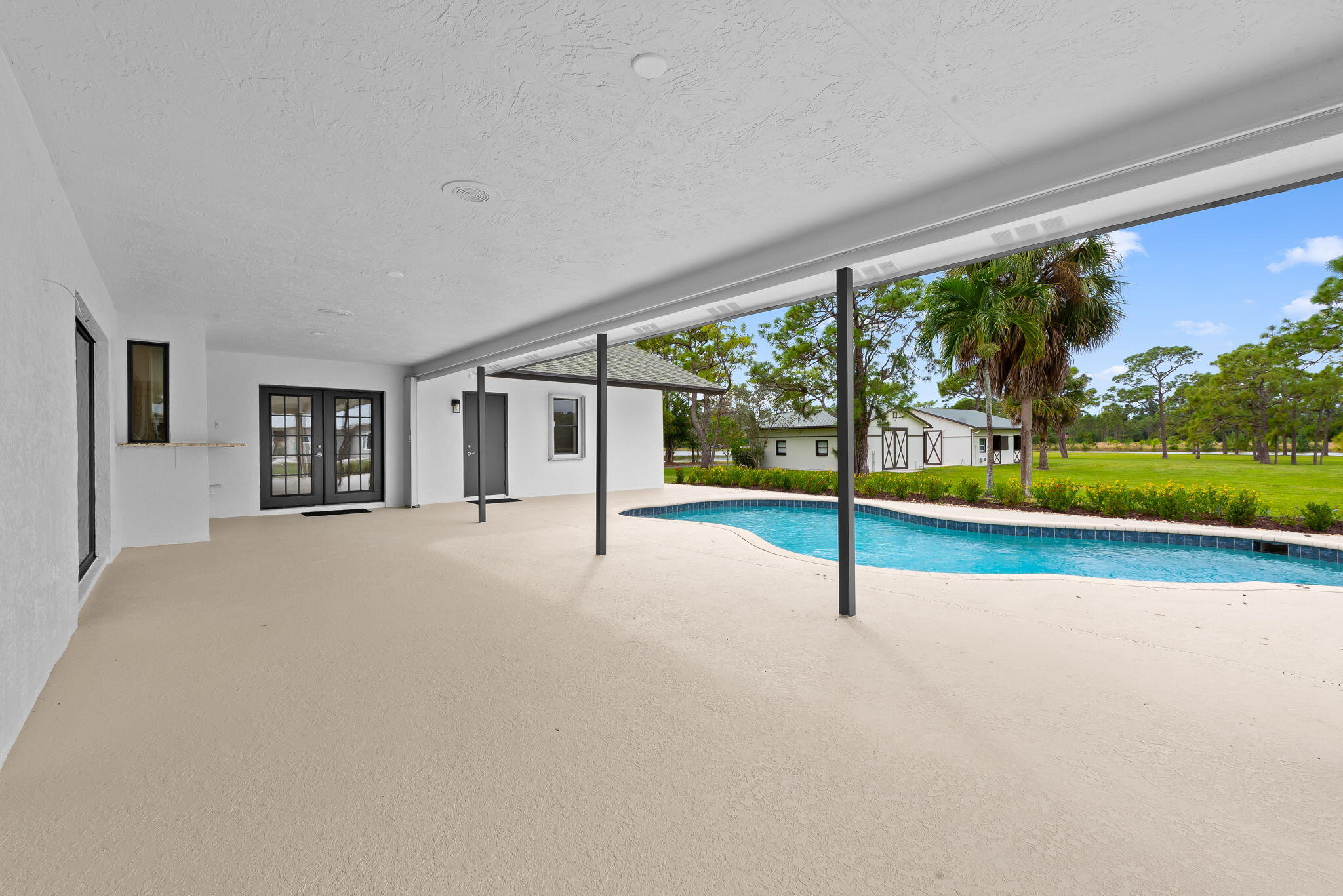5635 Reynolds Road Lake Worth, FL 33449 - Photo 8 of 40 a house with outdoor space and street view