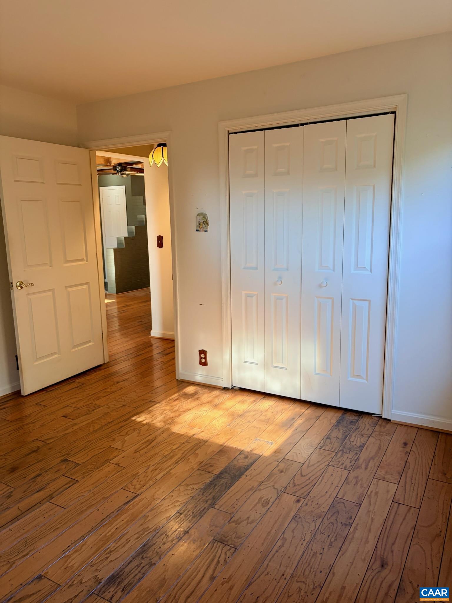 699 Winton Road Amherst, VA 24521 - Photo 17 of 35 a view of an empty room with wooden floor and closet area