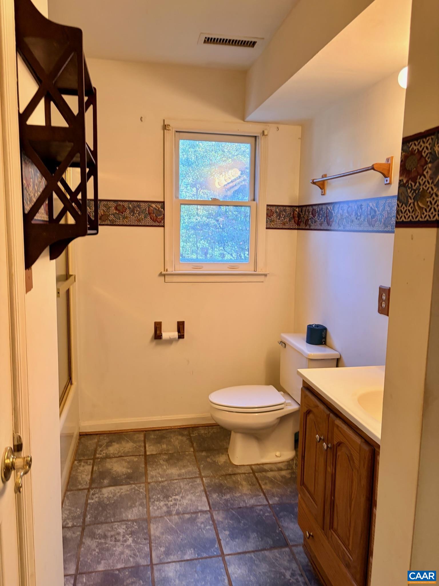699 Winton Road Amherst, VA 24521 - Photo 18 of 35 a bathroom with a sink a toilet and a shower